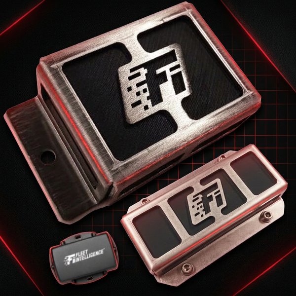 Mini T.A.C. — two stainless-steel attachment-tracking housings with the Fi logo cut into their faces, shown alongside the small black Fleet Intelligence tracker device on a dark red-grid background.